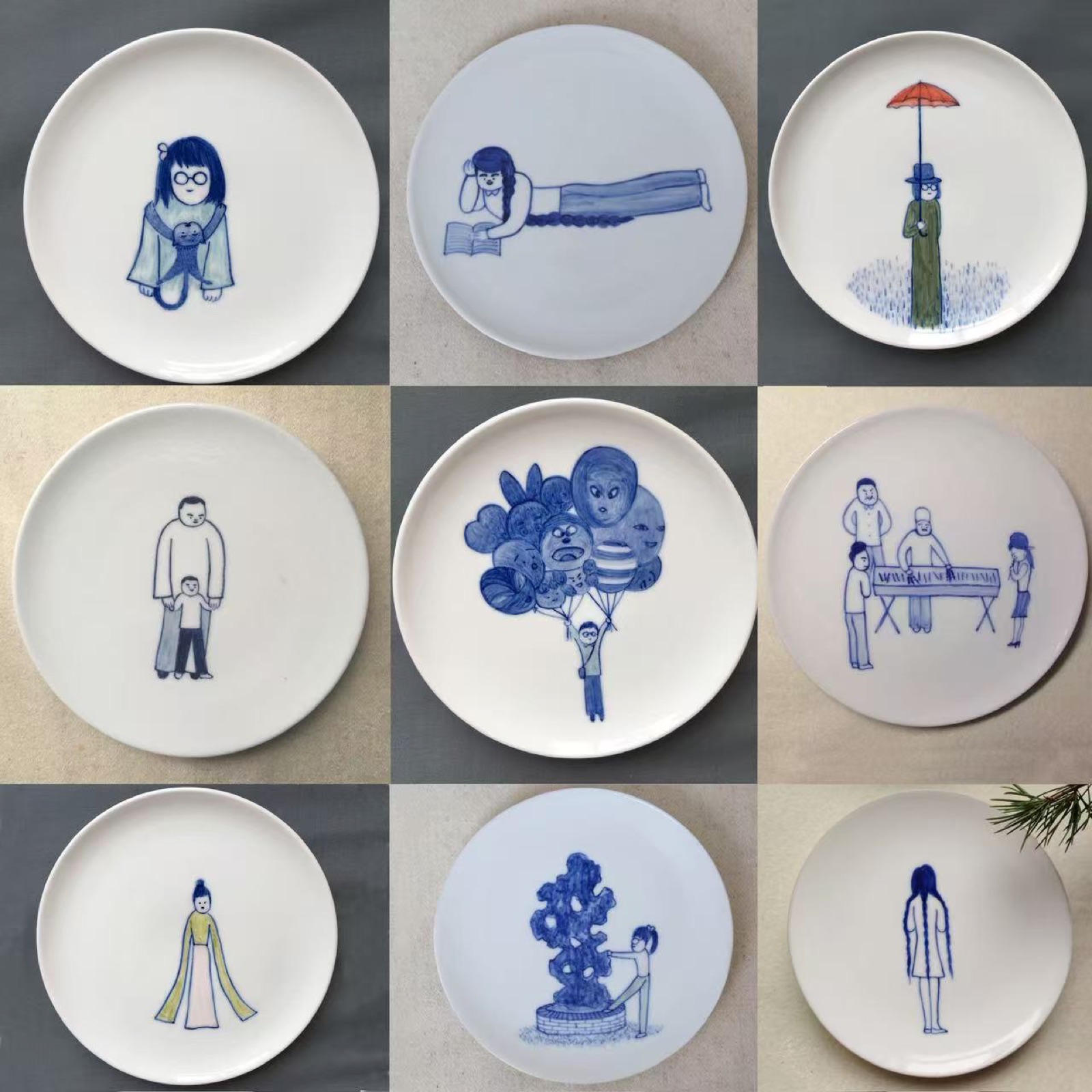 Deng Ying illustrated porcelain plates with blue line figures.